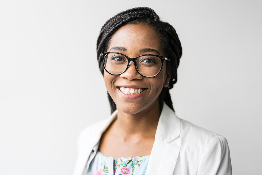 Portrait photo of a young Black woman in business dress