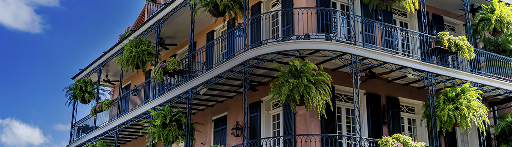 Photo of building in New Orleans with wrap-around balcony