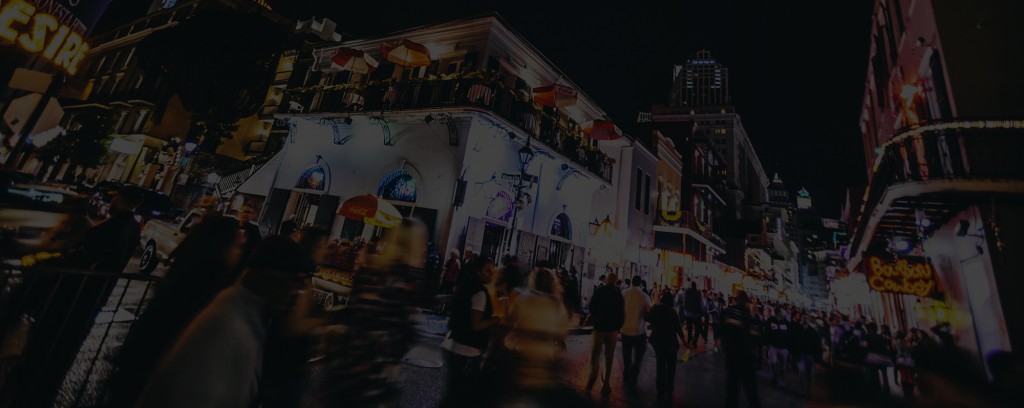 Photograph of New Orleans city street with active nightlife