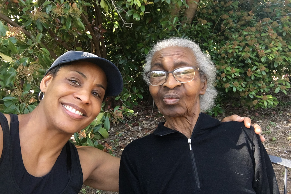 Photo of Julia Yarbough with her mother standing outdoors.